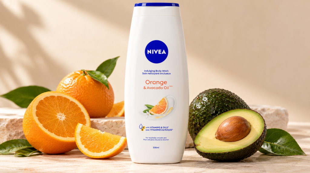 Iivea Orange and Avocado Oil Shower gel 500ml bottle with fresh oranges and avocado on a warm ivory background.